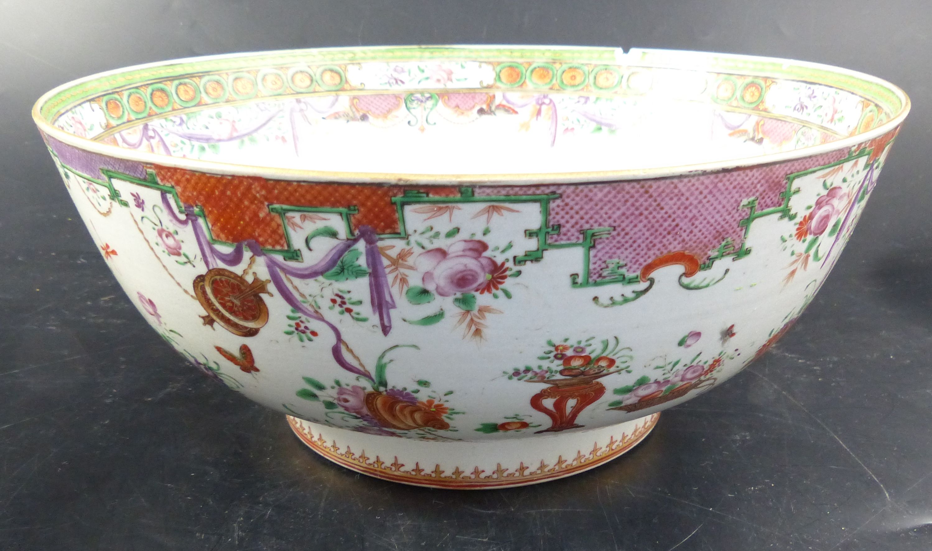 A pair of famille rose punch bowls, Qing dynasty, 18th century, diameter 29cm (both a.f.)